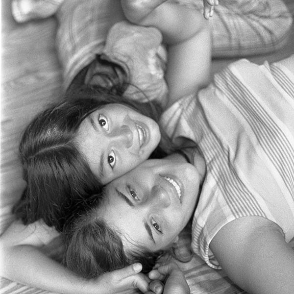 Two Girls on Floor in Cabin